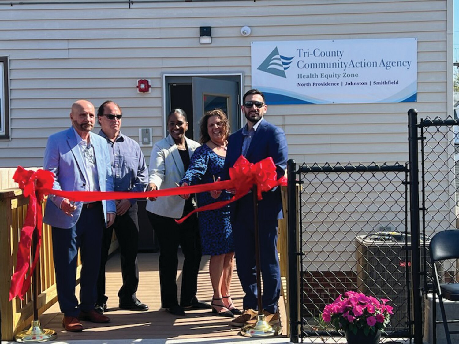 HEZ DISPENSER: Tri-County Community Action Agency snipped the ribbon on a new Health Equity Zone (HEZ) Community Center at 104 Greenville Ave. in Johnston. From left to right, Tri-County President and CEO Joseph DeSantis, Johnston Town Council member Alfred T. Carnevale, Nadine Tavares, lead HEZ initiative project officer with the Rhode Island Department of Health, HEZ Director Lisa Kennedy, and Johnston Mayor Joseph Polisena Jr. helped cut the ribbon on the new center. (Photos courtesy Tri-County)